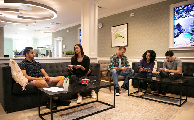 group playing cards and games in the living area